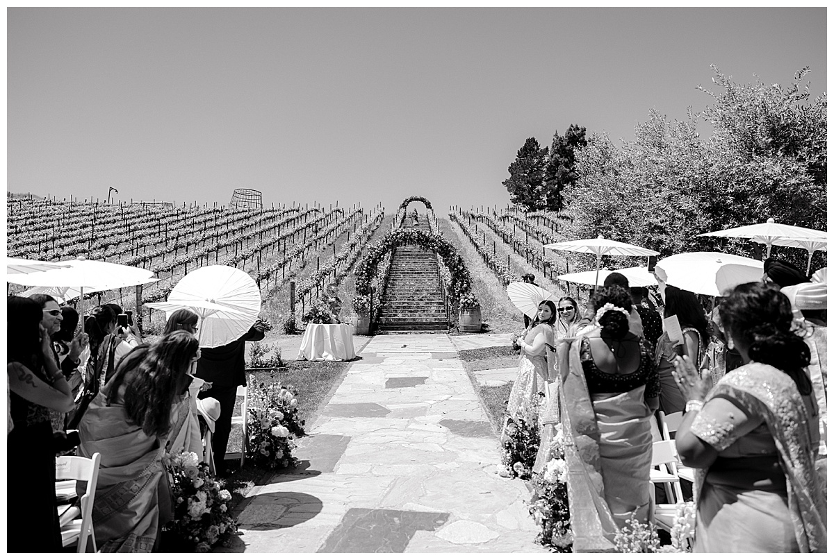 Indian bride descending stairs at Nella Terra Cellars 