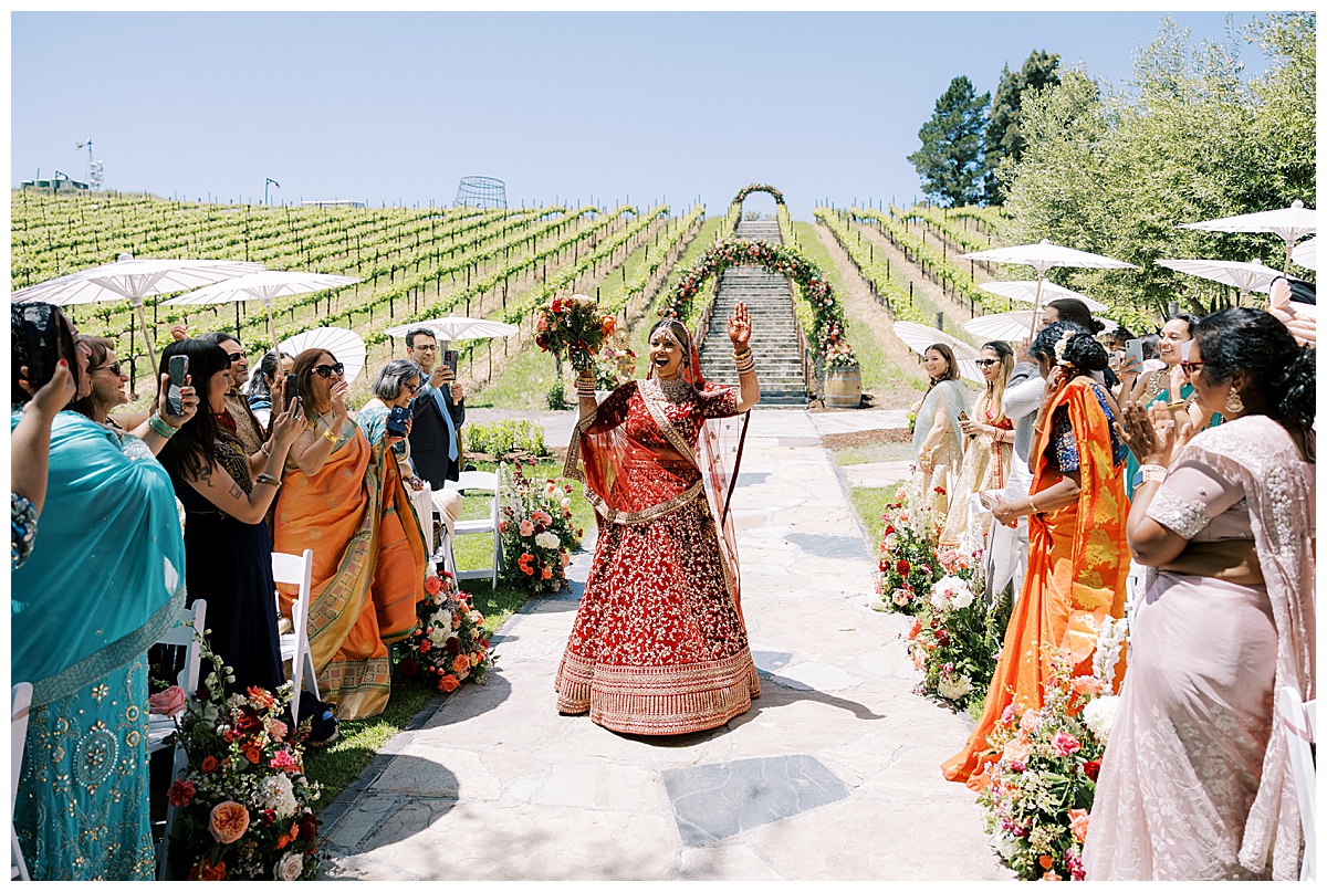 bride enters into ceremony at Nella Terra cellars