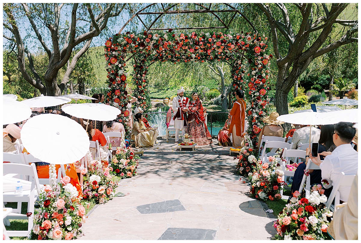 wide photo of indian wedding on the mandap at Nella Terra cellars