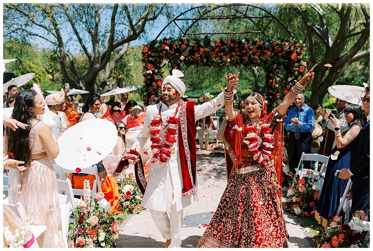indian couple celebrating down the aisle at Nella Terra cellars
