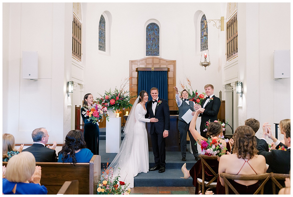 Married couple standing at the altar at Presidio Chapel in San Francisco 