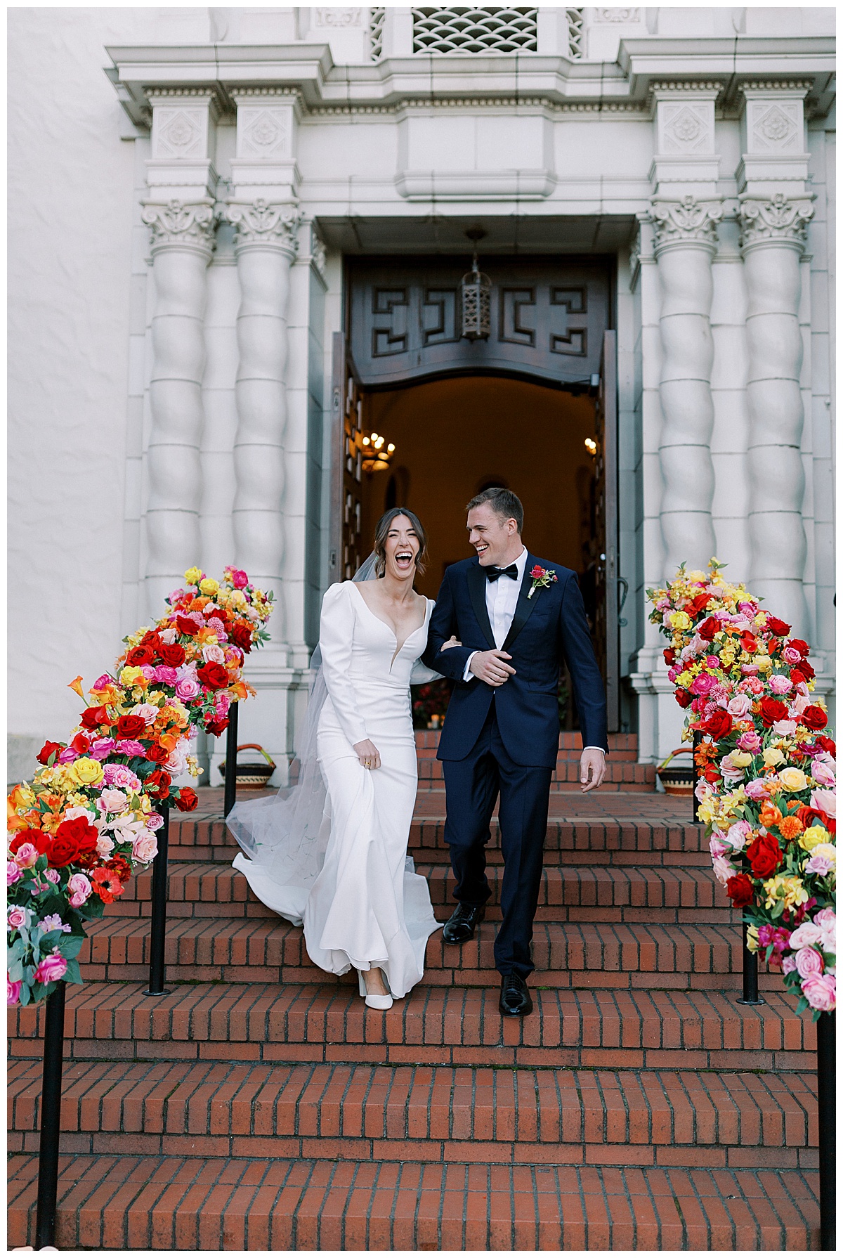 Bride and groom laughing as they exit Presidio Chapel in San Francisco