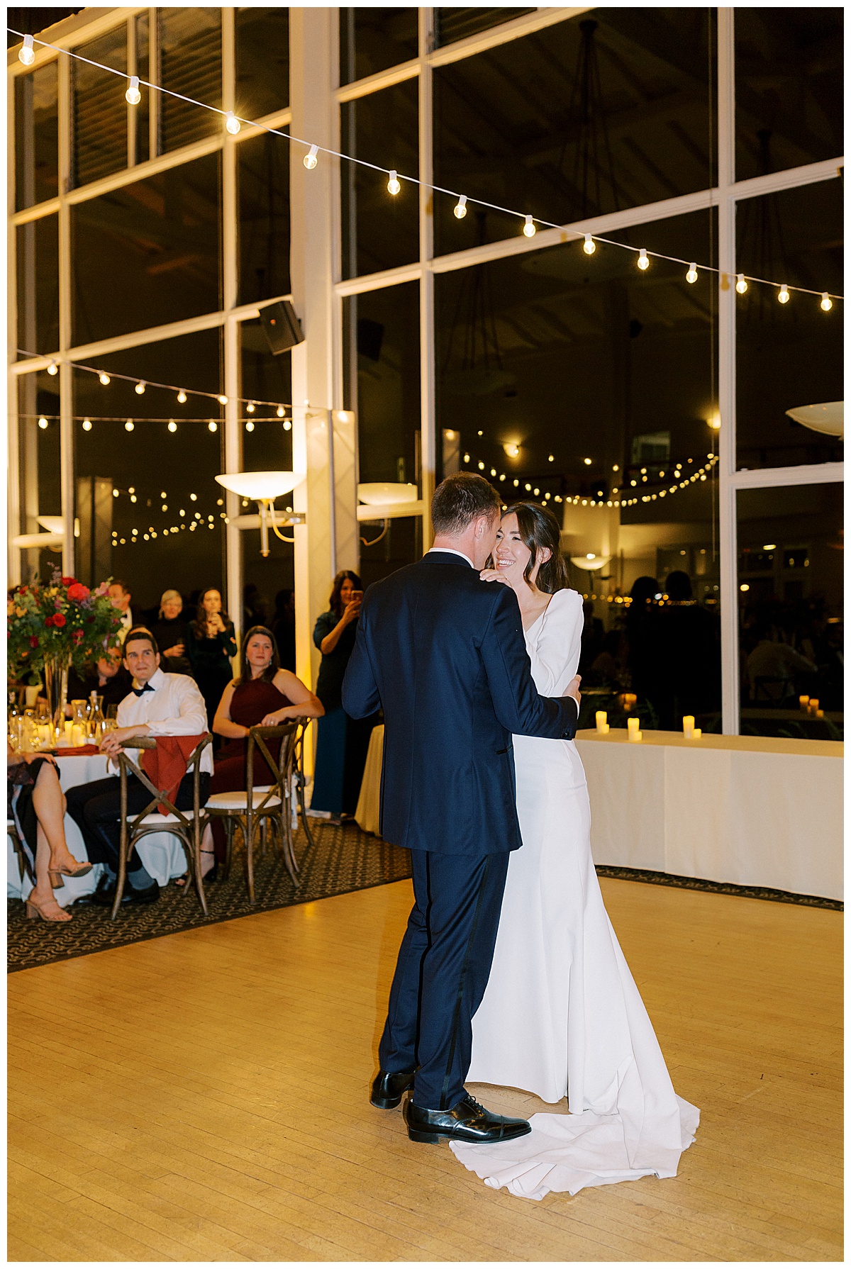 Married couple having first dance under lights at Golden Gate Club