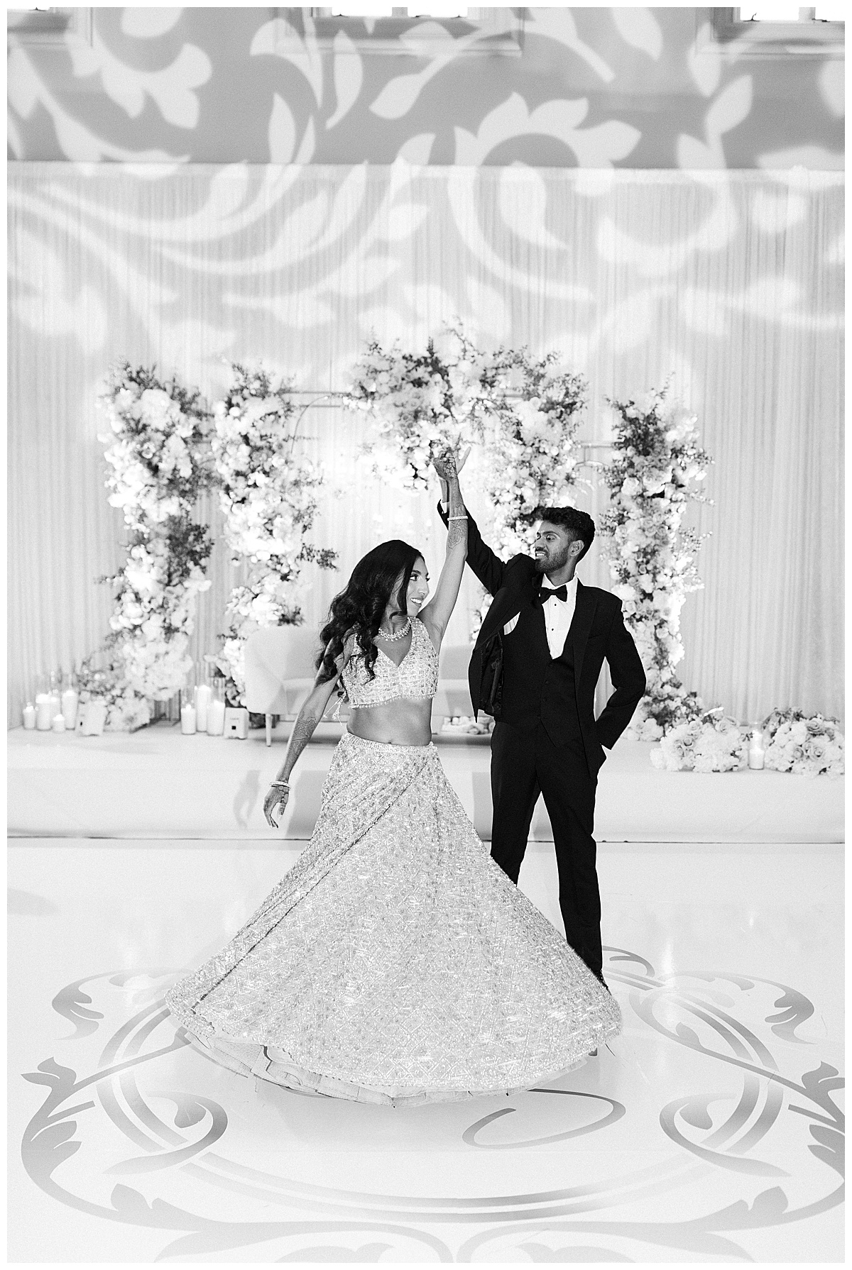 black and white image of a couple dancing to their first dance song at the club at ruby hill