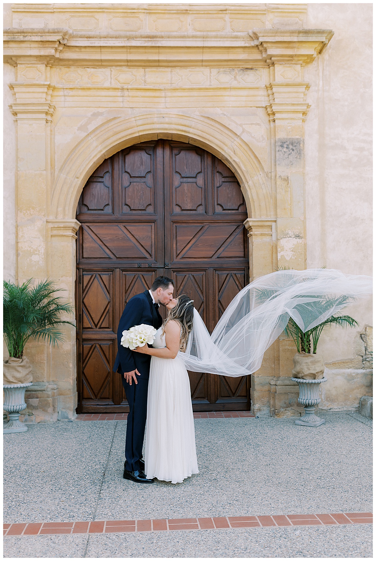 couple outside of carmel mission basilica