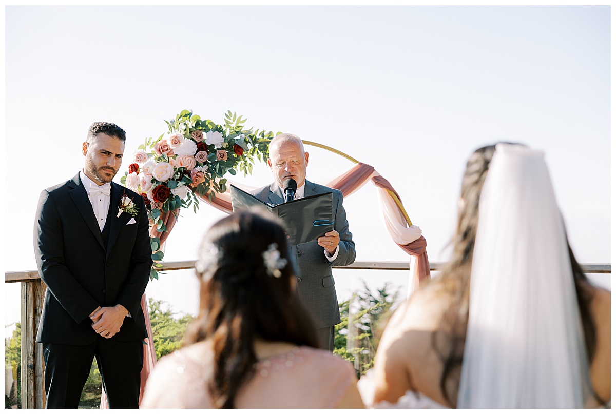 groom waiting for bride to come down the aisle at carmel highlands Hyatt