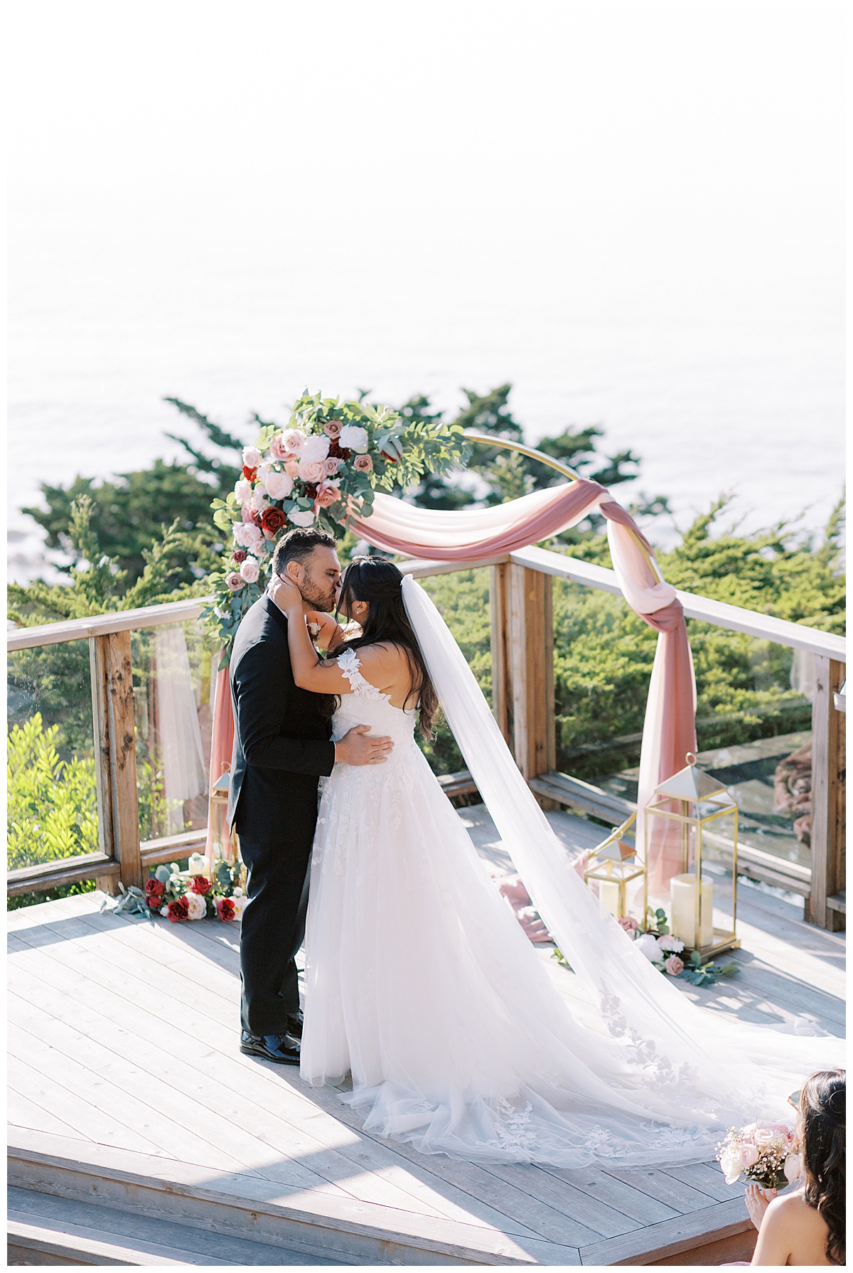 couples first kiss during ceremony at carmel highlands Hyatt 