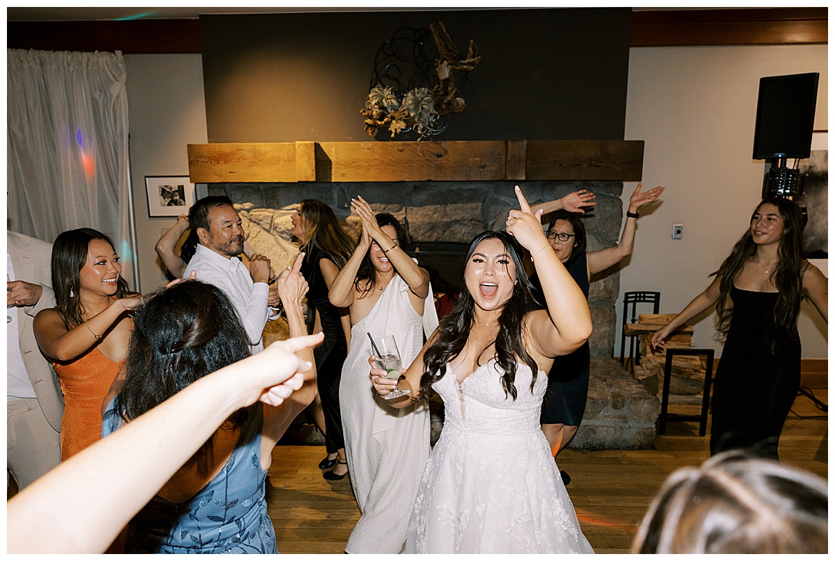 bride and friends dance at carmel highlands Hyatt wedding reception