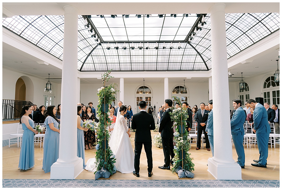 couple getting married inside of olympic club in San Francisco