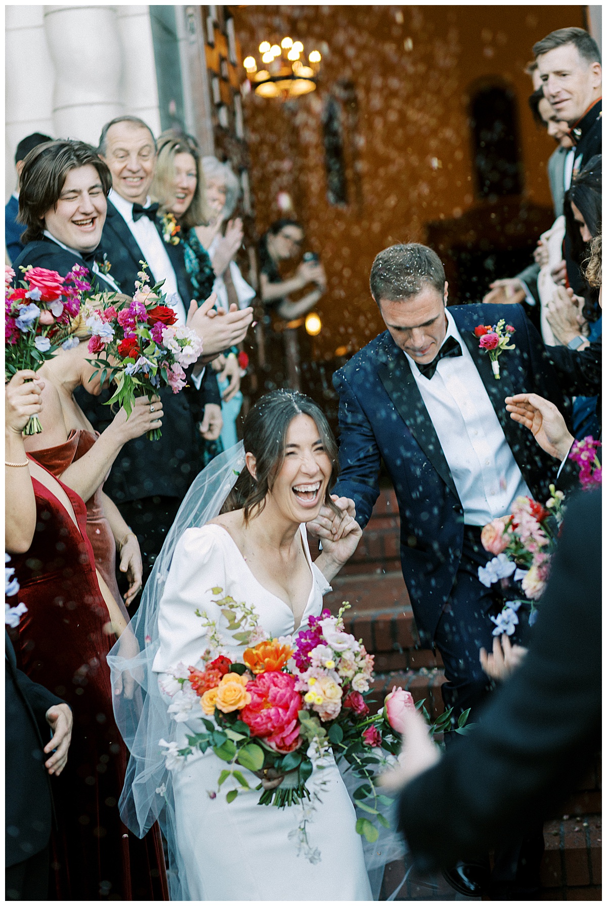 flower petal toss at bride and groom post wedding ceremony exiting the chapel