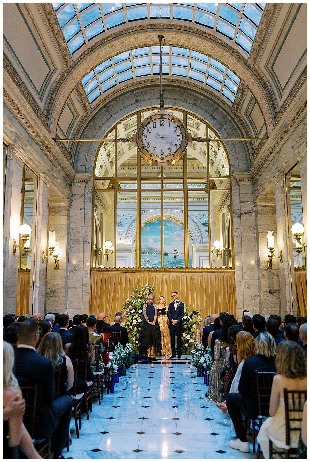 vertical photo of bride and groom standing at the alter at Julia morgan ballroom