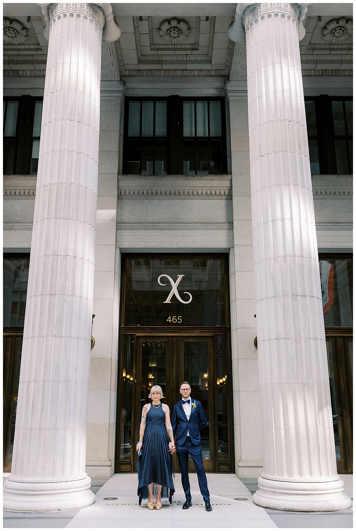 bride and groom standing hand in hand in front of Julia Morgan ballroom