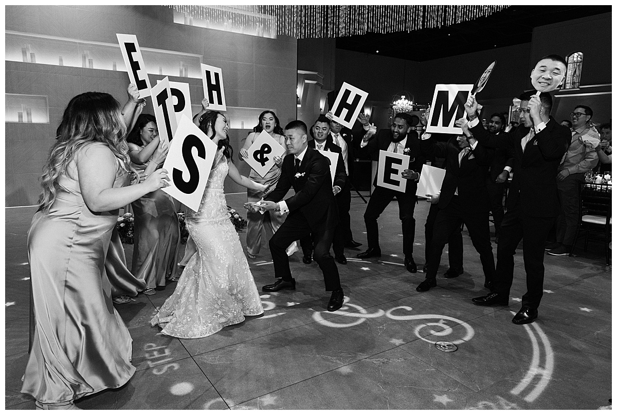 couple's grand entrance dance party into their wedding reception at palm event center