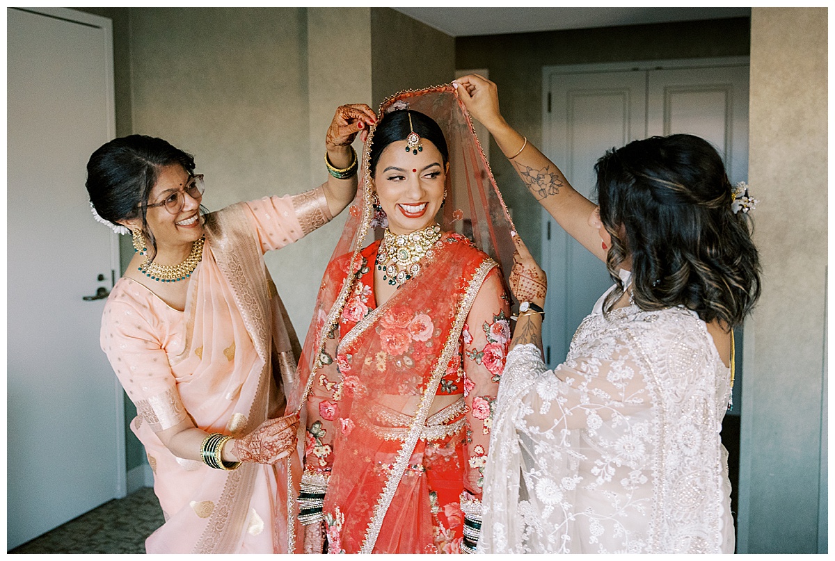 mother and sister help indian bride get ready at the Hyatt sfo