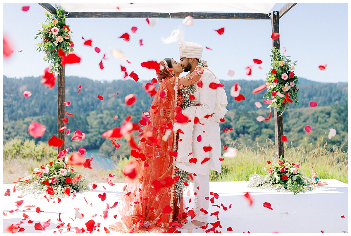flower petal toss while bride and groom kiss post ceremony at fairview crystal springs