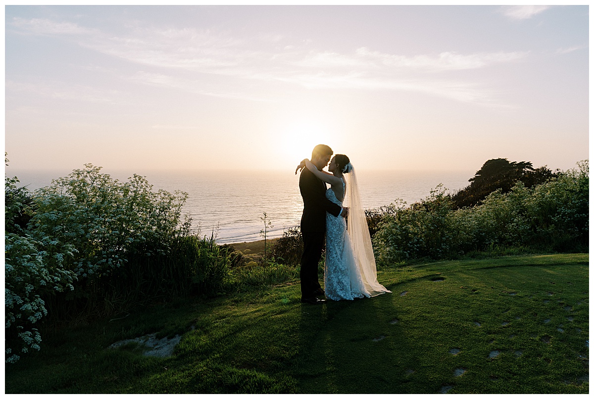 bride and groom at sunset by the water at the olympic club
