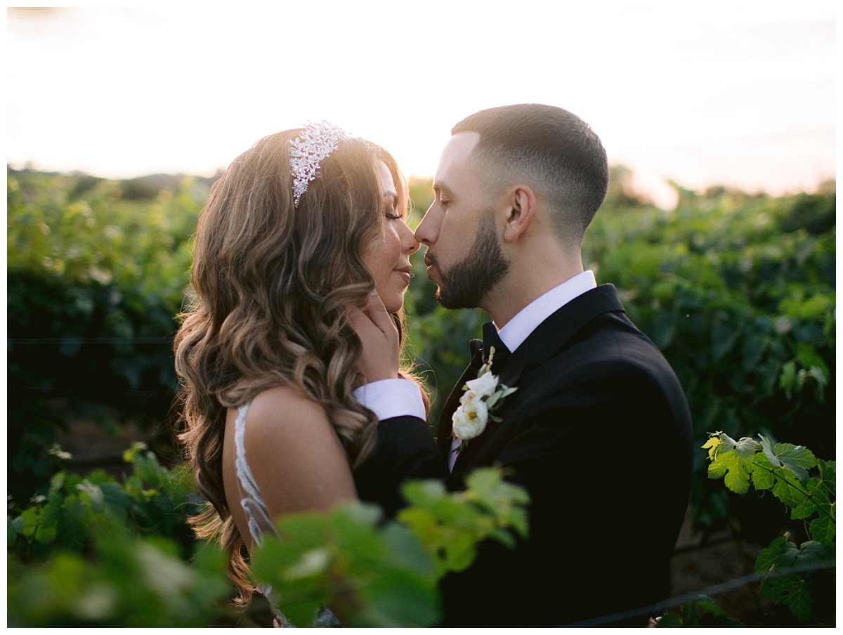 bride and groom nearly kissing at sunset