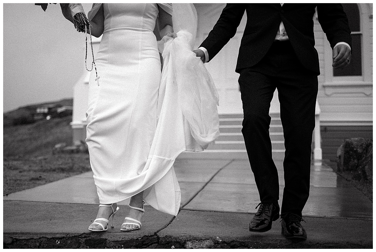 details of bride and groom walking