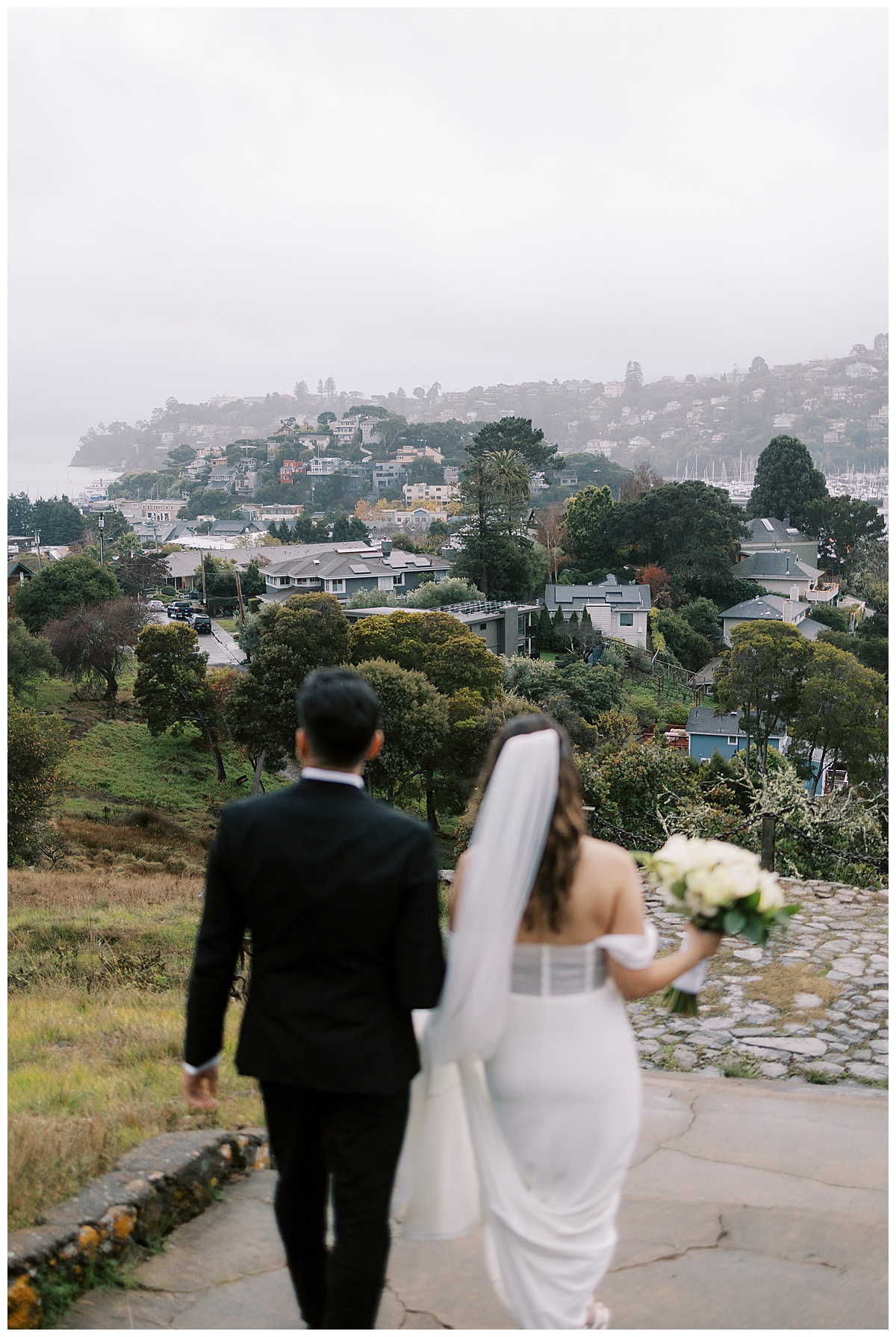 out of focus couple walking away with Tiburon in focus