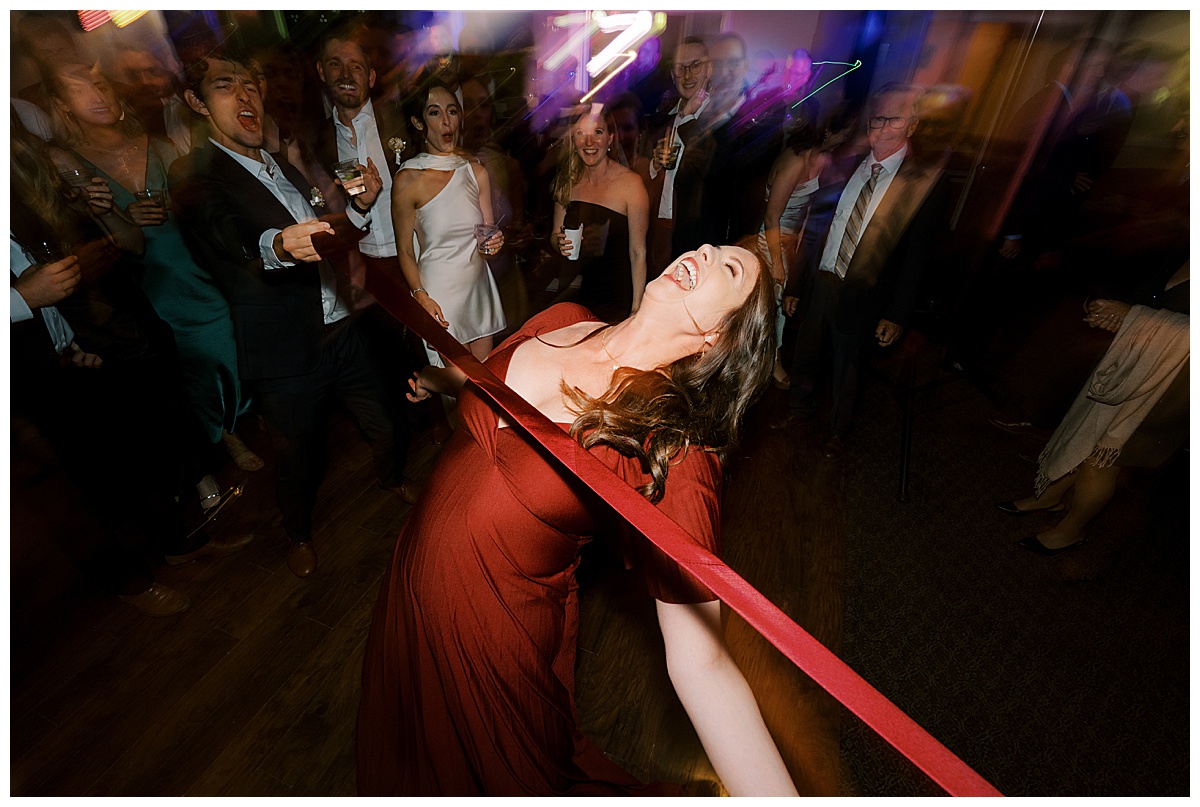 wedding guest gets down on the dance floor during reception at deer park villa