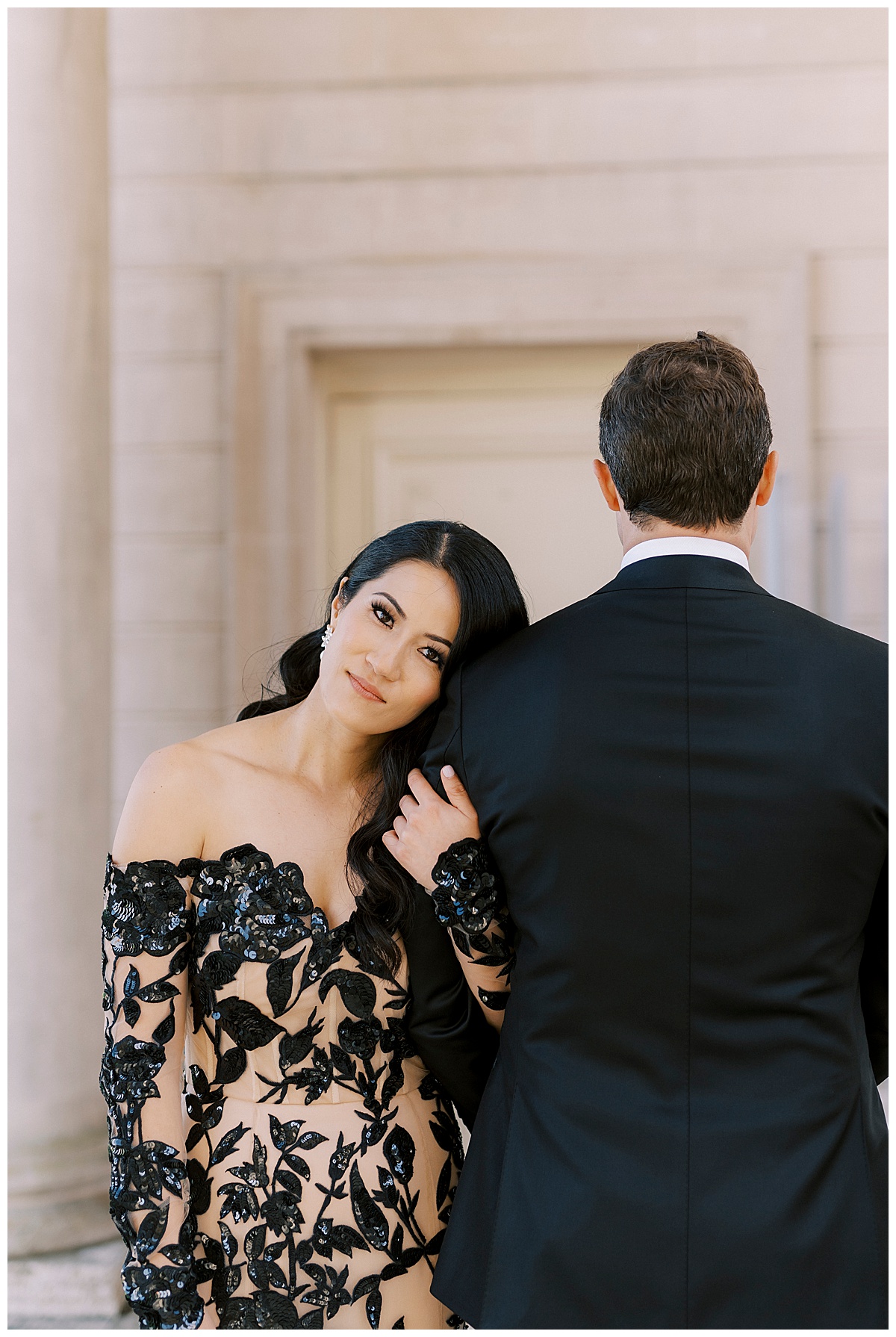 portrait of elegantly dressed bride resting head on grooms shoulder at legion of honor in San Francisco 