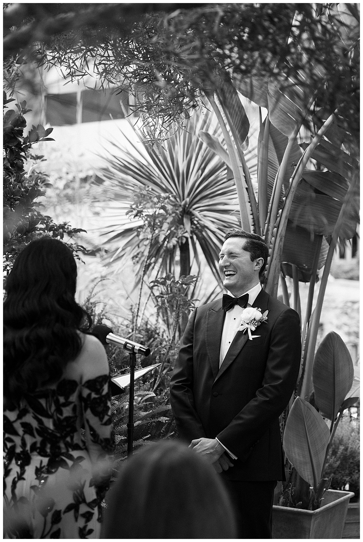 groom laughing during wedding ceremony at plant connection sf