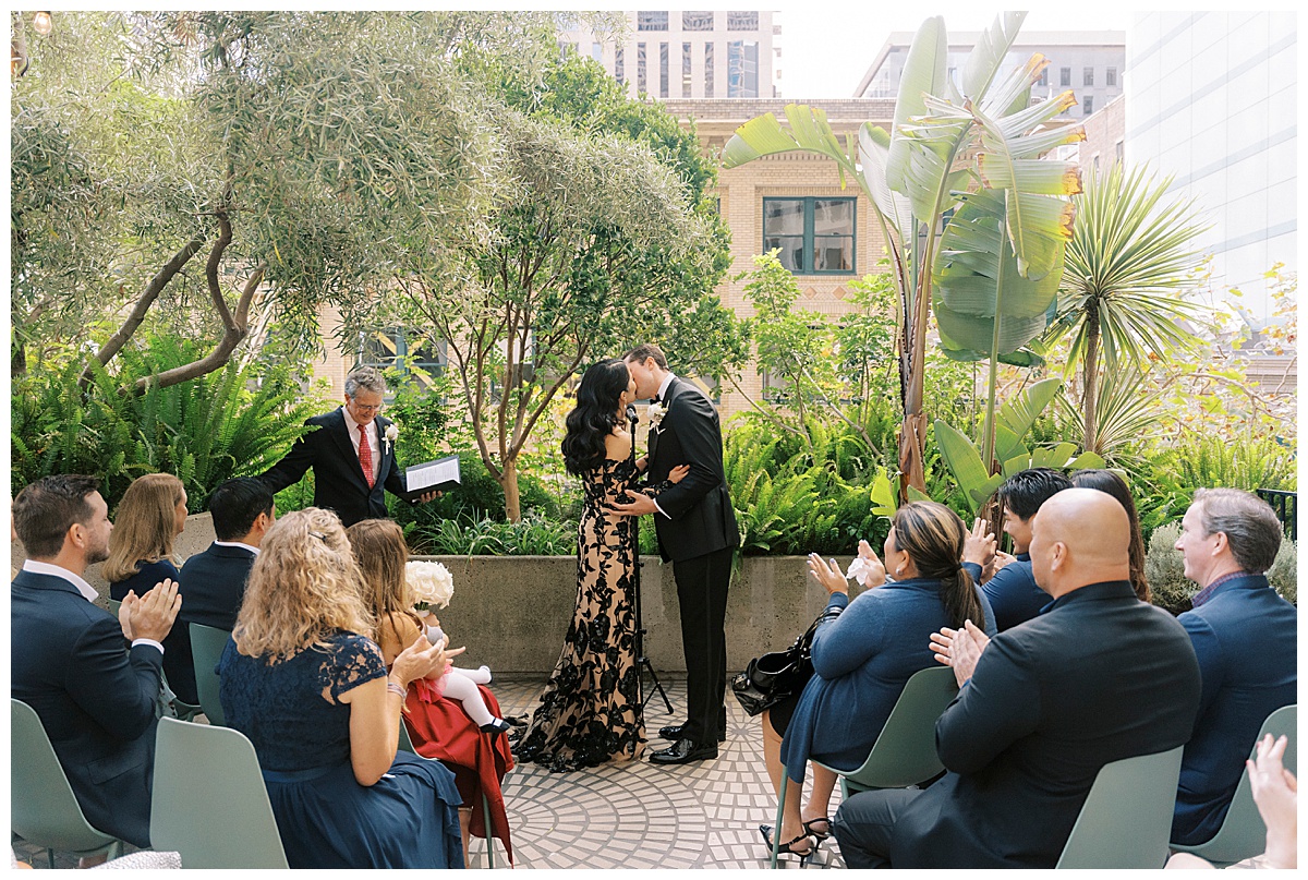 the first kiss after a wedding ceremony at plant connection sf in downtown San Francisco