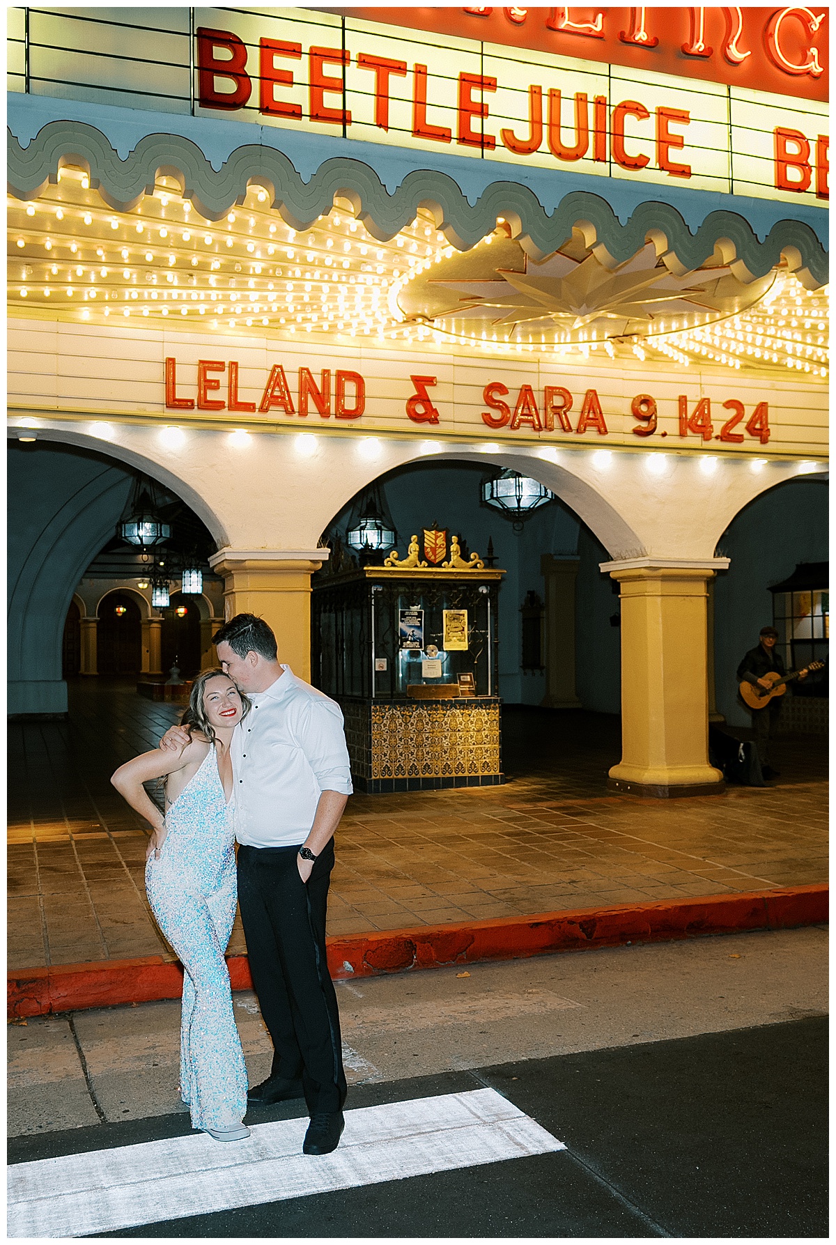 groom kissing brides forehead outside of villa and vine