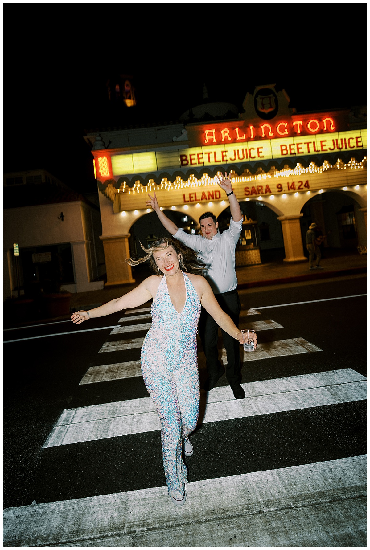 bride and groom dancing at night in the crosswalk in Santa Barbara