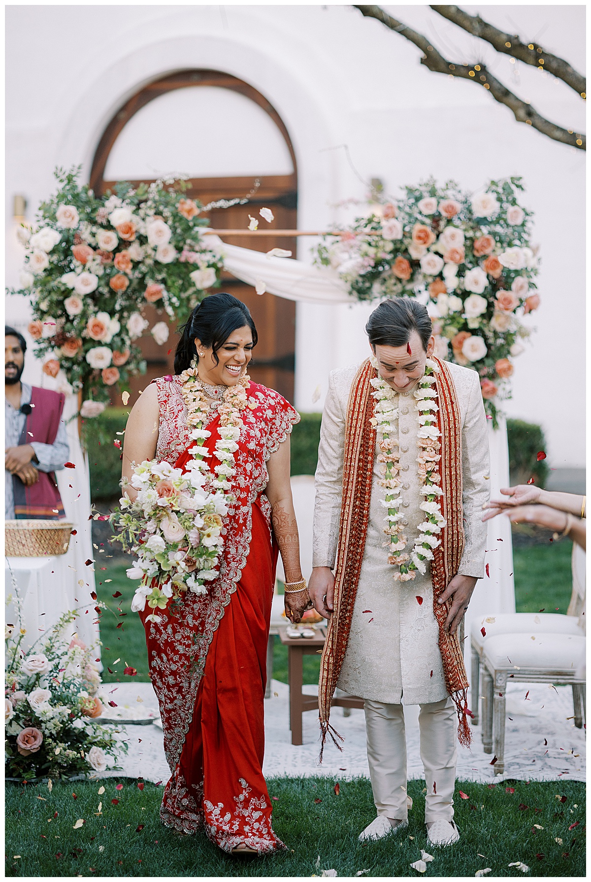 Couple exiting Indian wedding ceremony at Wente vineyards