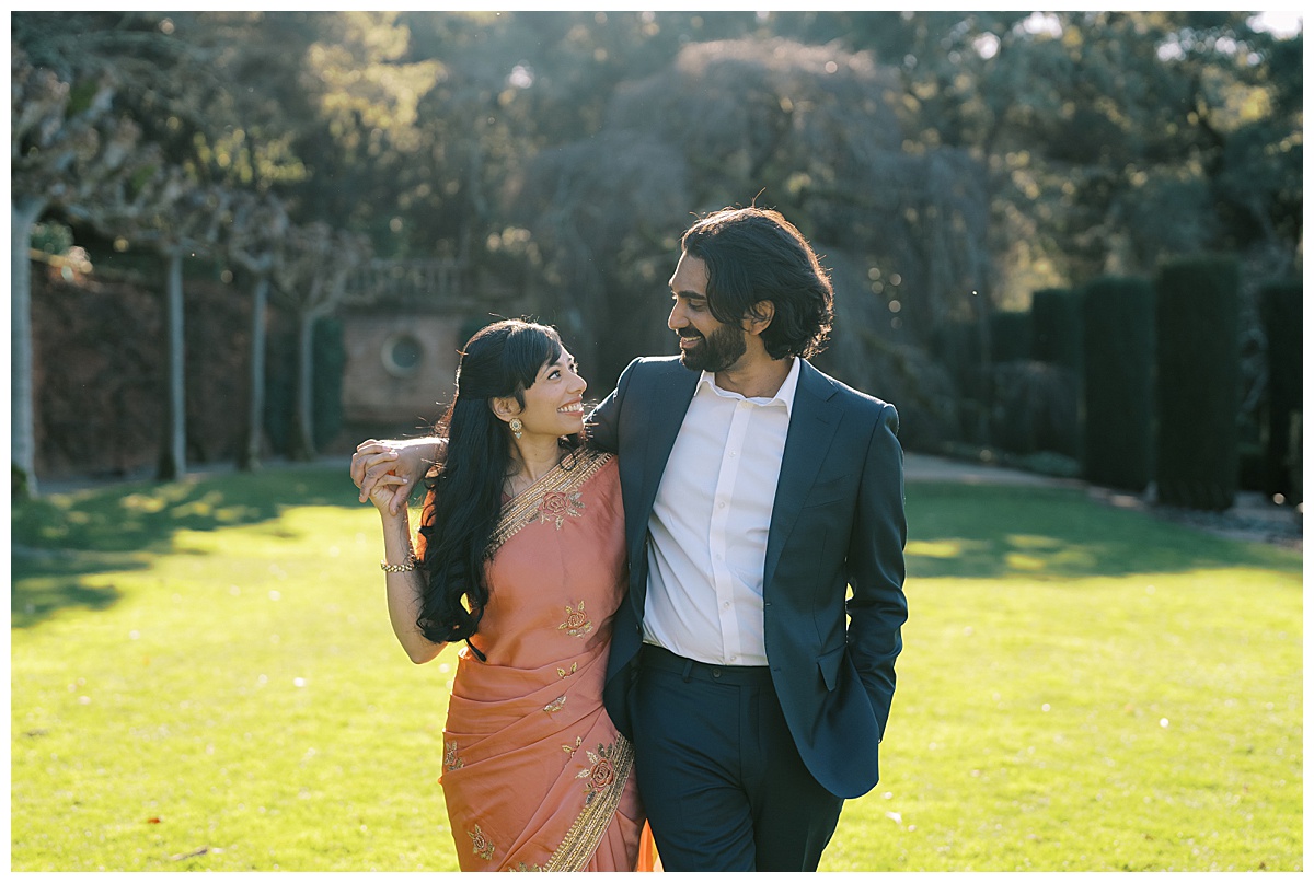 couple walking at filoli gardens during engagement photos