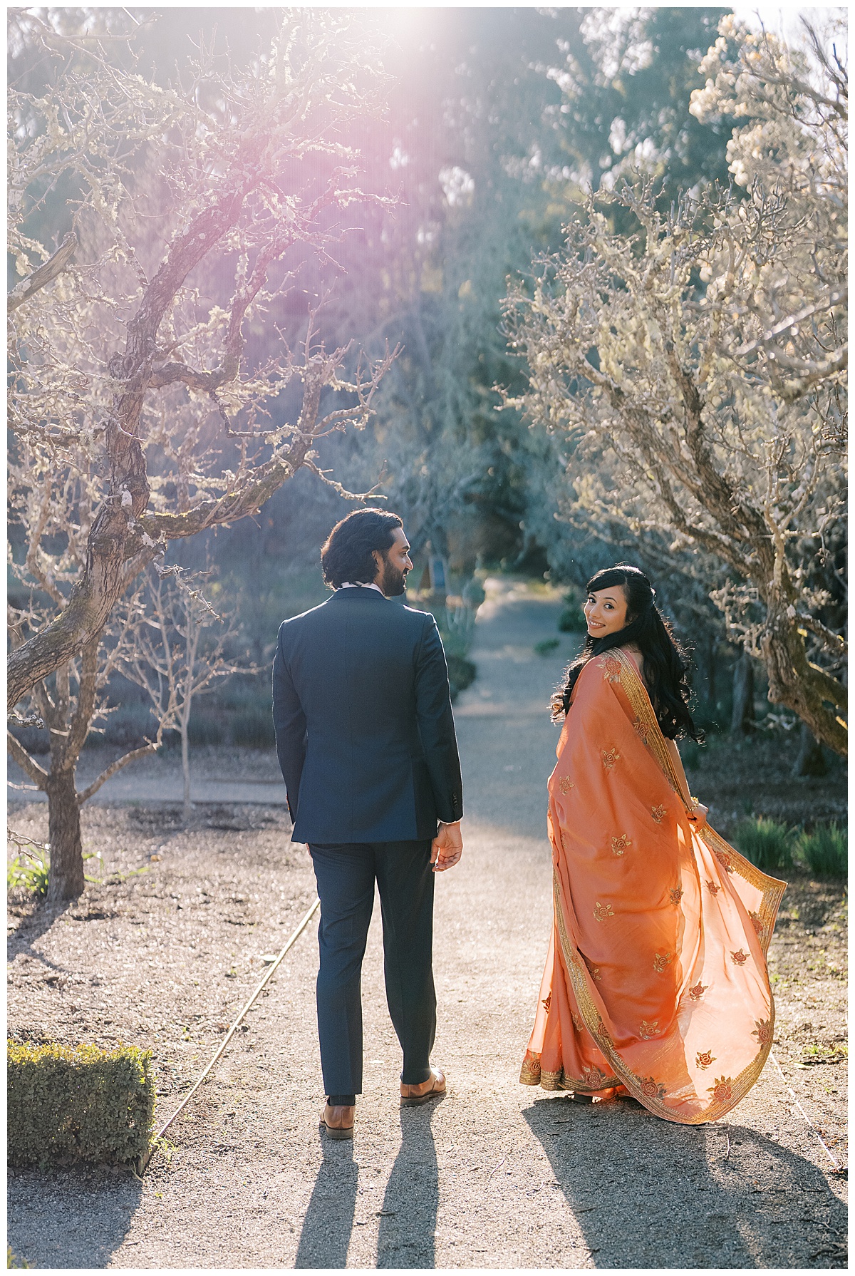couple walking at filoli gardens during engagement photos