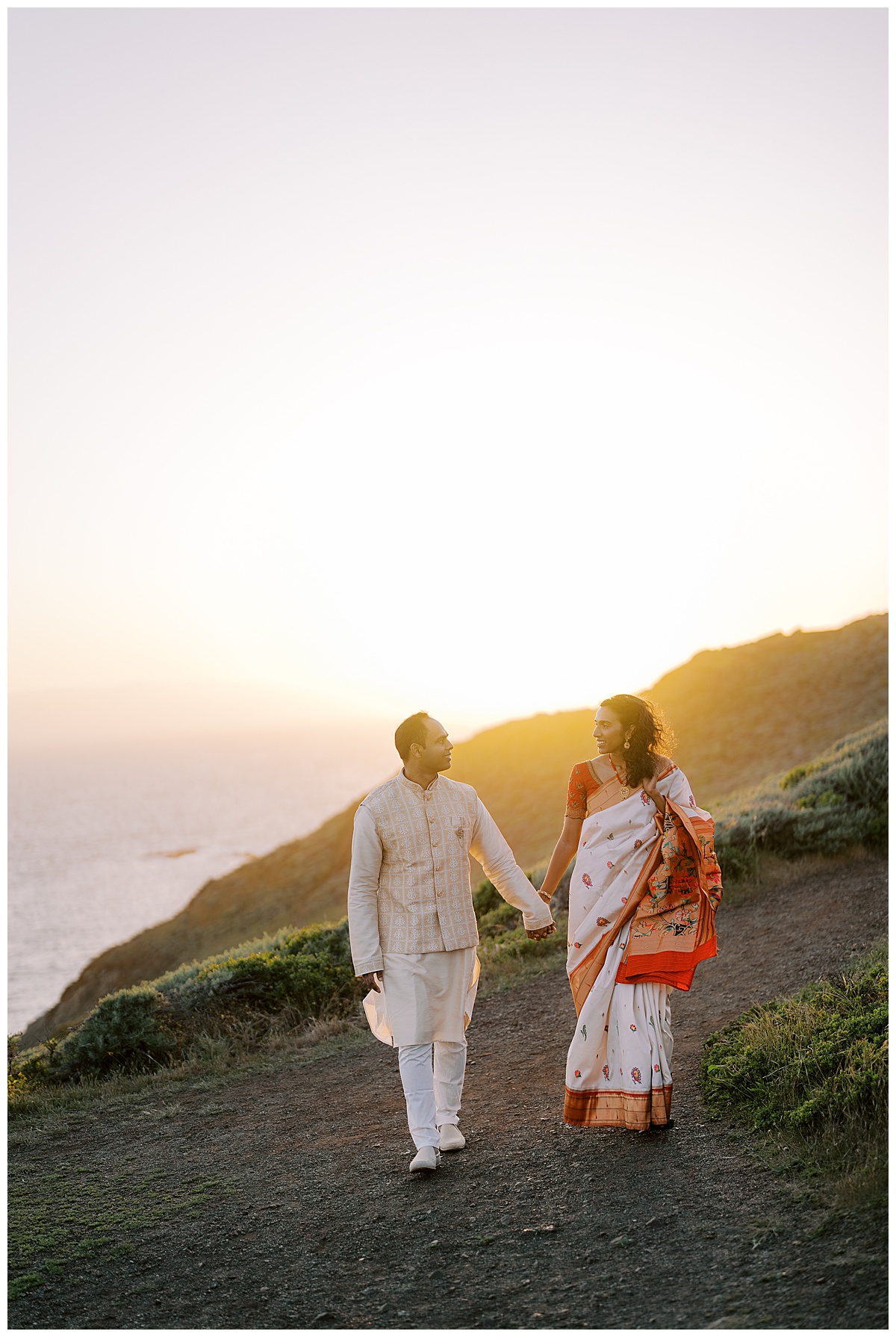 indian couple walking at sunset during engagement session