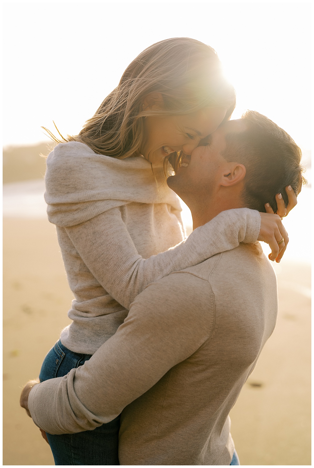 couple kissing at sunset at baker Bech
