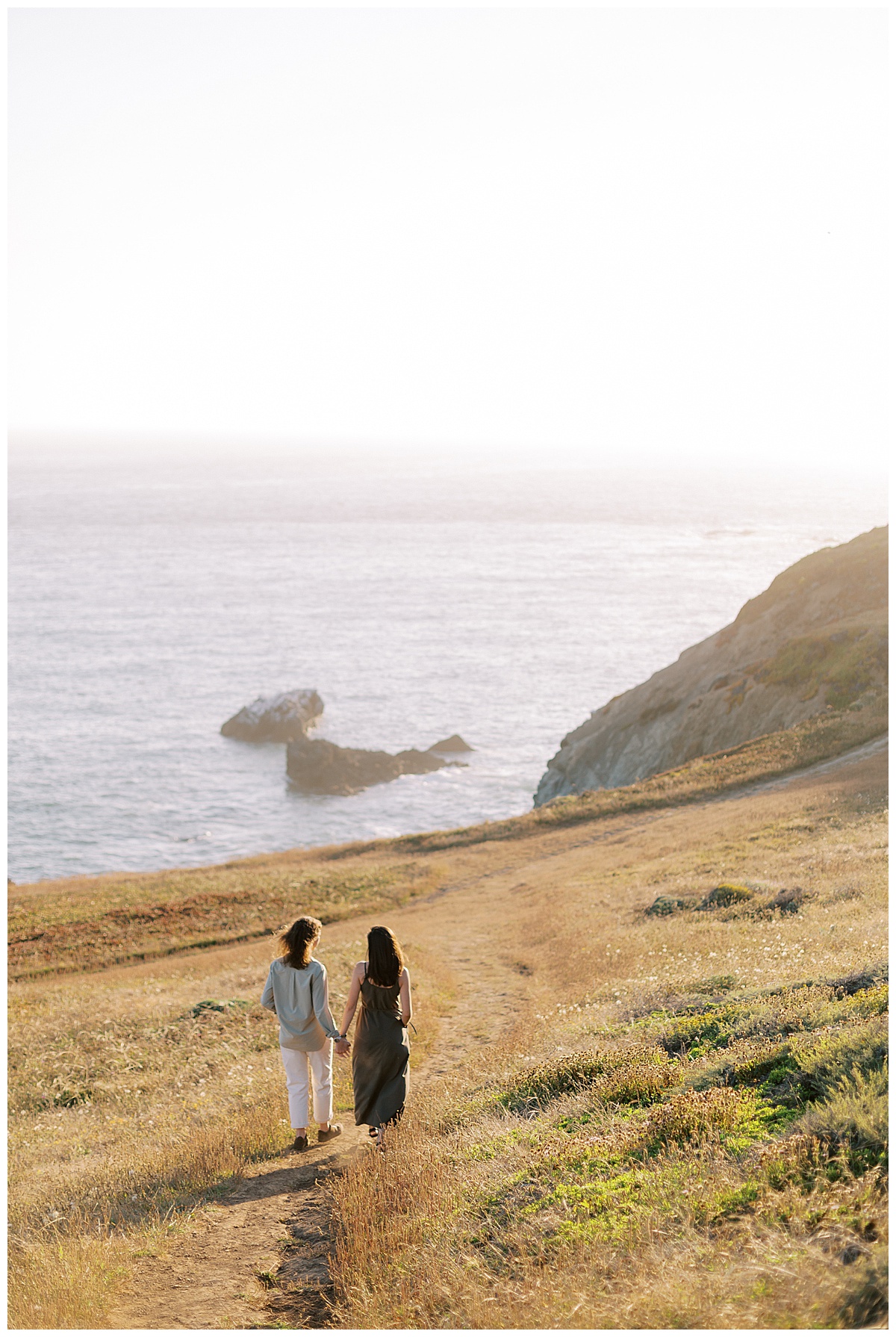 lesbian couple at rodeo beach during engagement session